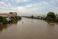 A landscape pictures of the shores of the mekong river in south vietnam near vinh long on a sunny summer day