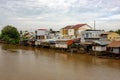 A landscape pictures of the shores of the mekong river in south vietnam near vinh long on a sunny summer day