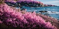 Landscape with pink flowers, rocks, beach and beautiful turquoise sea water. Royalty Free Stock Photo