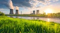 Landscape with pipes with steam at nuclear power plant near of green grass field and river, green energy concept Royalty Free Stock Photo