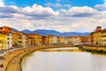 Landscape with Pisa old town and Arno river, Tuscany, Italy. A bridge passes over the river and houses on both sides are Royalty Free Stock Photo