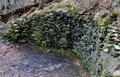 a landscape plagued by frost and snow with walls of flat stones