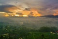 Landscape of plantation and village with fog Royalty Free Stock Photo