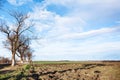 Landscape with ploughed fields in early spring Royalty Free Stock Photo