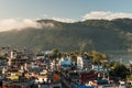 Landscape with Pokhara rooftops on sunrise with Annapurna South, Hiunchuli and Machapuchare Fishtail Peaks in background. Himalay