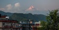 Landscape with Pokhara rooftops on sunrise with Annapurna South, Hiunchuli and Machapuchare Fishtail Peaks in background. Himalaya Royalty Free Stock Photo