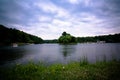 landscape with pond, pedal boats and beautiful cloudy sky