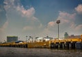 Landscape of the Port of Manila with giant rain clouds in the background.