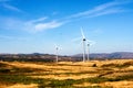 Wind turbines on hilly expanse create energy, Portugal Europe