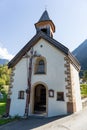 Landscape protection area AchstÃÂ¼rze. Blasius chapel in Oetz-Piburg, alps in background. Tirol oldest nature preserves. Royalty Free Stock Photo