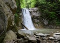 The landscape of Pruncea waterfall and the Casoca river in the Buzau mountains, Romania. A beautiful cascade in the forest