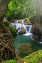 Landscape of pure tropical waterfall on rainy morning Royalty Free Stock Photo
