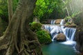 Landscape of pure tropical waterfall on rainy morning Royalty Free Stock Photo