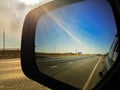 Landscape reflected in car rearview mirror Royalty Free Stock Photo