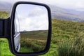 Landscape reflecting in car mirror Royalty Free Stock Photo