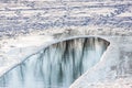 Landscape reflection of trees in a forest in an ice hole on a snowy ice lake Royalty Free Stock Photo