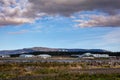 Landscape of Reykjavik, Iceland. Domestic airport and Perlan building, mountains in background. Royalty Free Stock Photo