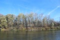 Landscape with river in autumn. Trees are reflected in water of river Royalty Free Stock Photo