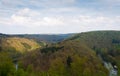 The landscape of the river in forest in summer on a hazy, warm day.