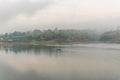 Landscape of river and houseboat with morning mist Royalty Free Stock Photo