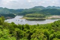 Landscape of river mountain and bamboo houseboat raft floating on riverside at a lake for relax in holiday - Huay Kra Ting Royalty Free Stock Photo