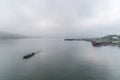 Landscape of river and houseboat with morning mist Royalty Free Stock Photo