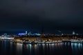 Landscape of a river surrounded by buildings and lights in the night in Stockholm, Sweden Royalty Free Stock Photo