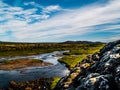 Landscape with Rivers, blue sky with clouds, green plants and hills in Iceland Royalty Free Stock Photo