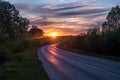 Landscape of road with blue red pink evening sky with beautiful clouds before sunset Royalty Free Stock Photo