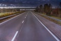 Landscape with road, cars, bridge and clouds, overcast day