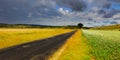 landscape and road with dark storm clouds Royalty Free Stock Photo