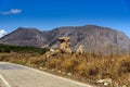 Landscape with road, mountains and old ruins at Crete island, Greece Royalty Free Stock Photo