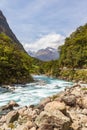 Landscape with road, river and snow-capped mountains. Fjordland national park, New Zealand Royalty Free Stock Photo