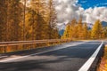 landscape with roadway. Highway in mountains in autumn day in Italy, empty asphalt road. Dolomites, Alps