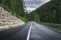 landscape with roadway. Highway in mountains in summer day in Italy, empty asphalt road. Dolomites, Alps