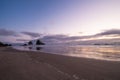 Landscape of rocks and the Pacific coast at sunset. Beautiful picture and night scenery of nature Royalty Free Stock Photo