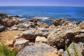 Landscape of rocky beach on blue sea. Scenery seascape on bright sunny summer day on tropical nature. Stones, rocks at coastline Royalty Free Stock Photo