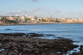 Landscape of a rocky coast overlooking the sea and the city at sunset in Estoril, Portugal Royalty Free Stock Photo