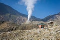 A landscape of rocky track on mount Papandayan that challenging for the hiker. Restroom and post on mountain track. The most