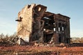 Landscape of ruined buildings at sunset, image of decrepitude or natural disaster