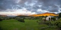 Landscape of a rural area on the Mourne Mountains under a cloudy sky in Northern Ireland Royalty Free Stock Photo