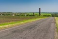 Landscape with rural road to remote Ukrainian village at spring season Royalty Free Stock Photo