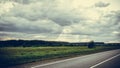 Landscape in Russia road field clouds forest