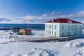 Russian city of Barentsburg on the Spitsbergen archipelago in the winter in the Arctic In sunny weather and blue sky