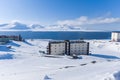 Russian city of Barentsburg on the Spitsbergen archipelago in the winter in the Arctic In sunny weather and blue sky