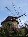 Rustic ancient windmill isolated on top of mountain