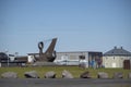 Landscape of rusty anchor statue and building in Keflavik Iceland