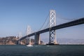Landscape of San Francisco - Oakland bay bridge with running boat Royalty Free Stock Photo