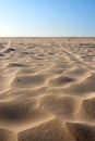 Landscape of sand dunes on west coast of Jutland in Loekken, Denmark. Closeup of sand surface texture on empty desert