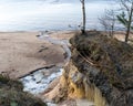 landscape with sandstone cliffs, bare ice, sand and ice formations, Veczemju cliffs, Latvia